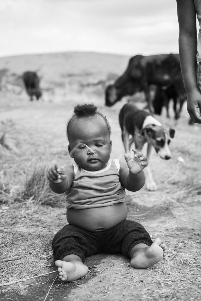 Black and white art photo of an African baby