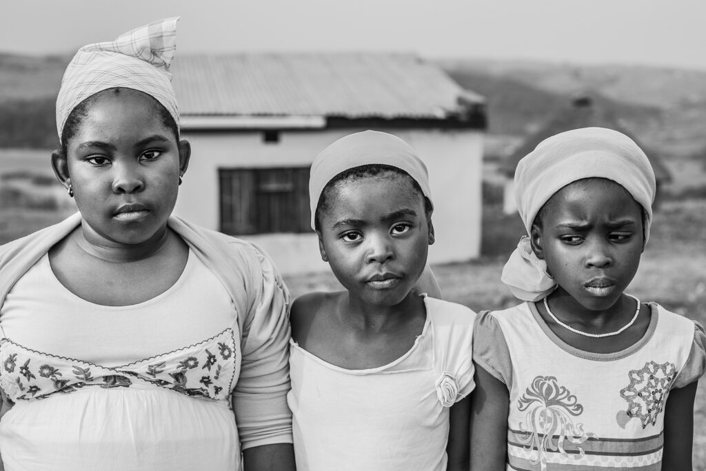 Black and white African art portrait of three young girls