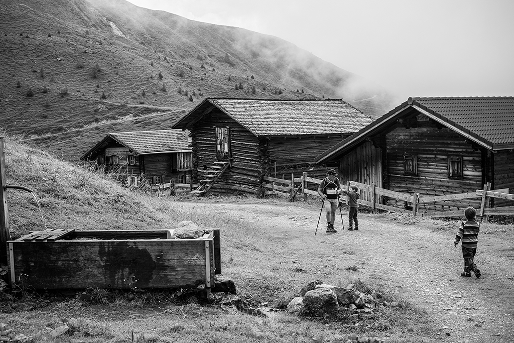 A picture of a mountain hiker arriving in Medergen, Swiss mountain village