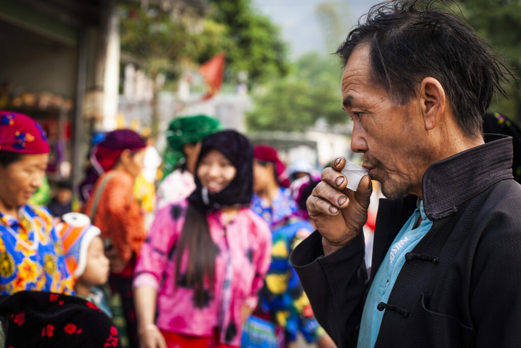 Photo of A Hmong man Tasting rice wine, Ha Giang Vietnam