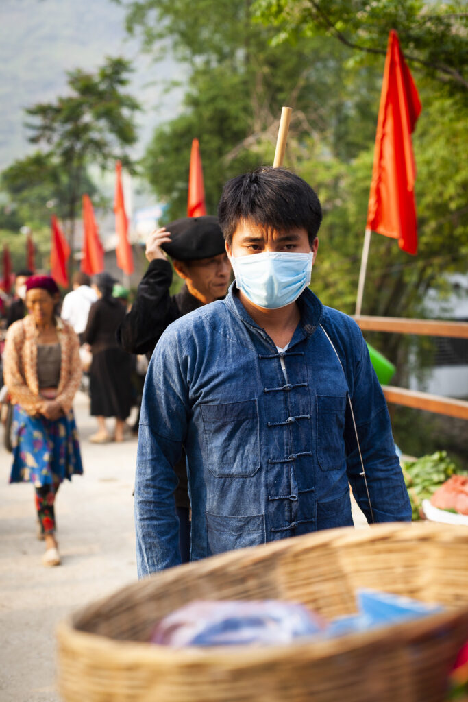 Photograph of a Hmong man with traditional blue shirt