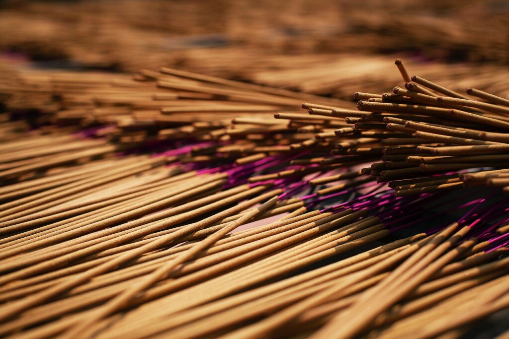 Close-up of incense sticks in drying process
