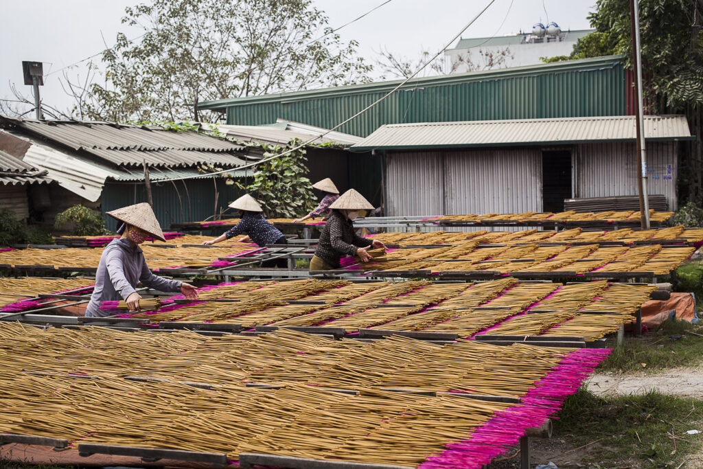 Full frame view of various tables of incense being laid out flat to dry