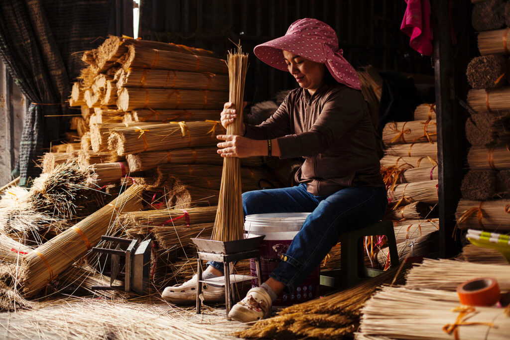 Portrait of A Vietnamese woman sorting incense