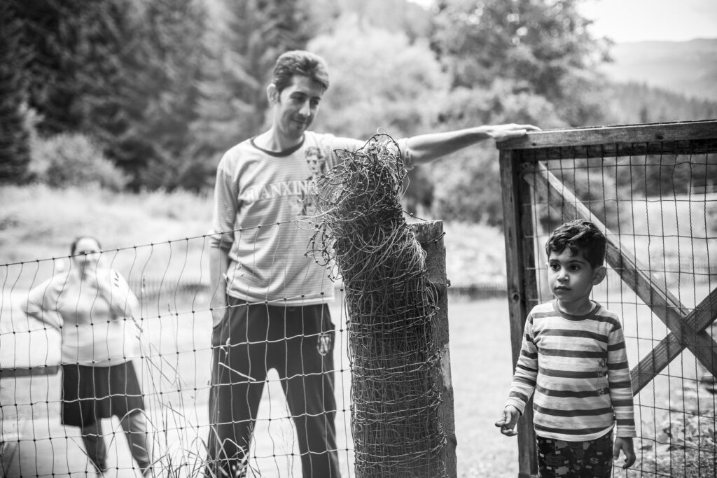 Photo of an asylum seeker dad looking proudly at his young son in Switzerland