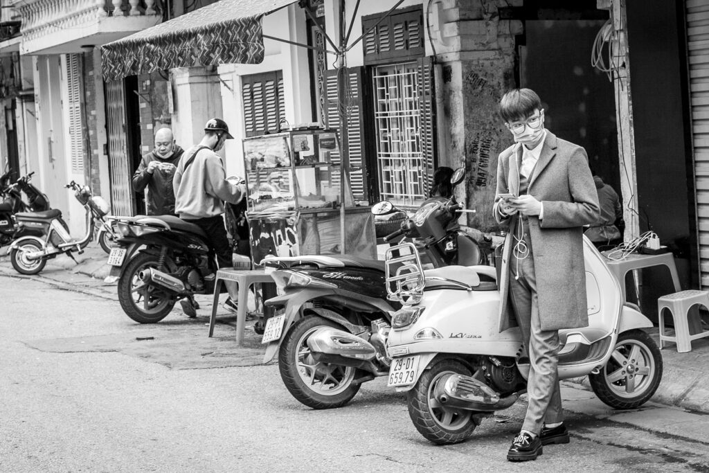 Vietnam street photography back and white candid portrait of a man dressed elegantly